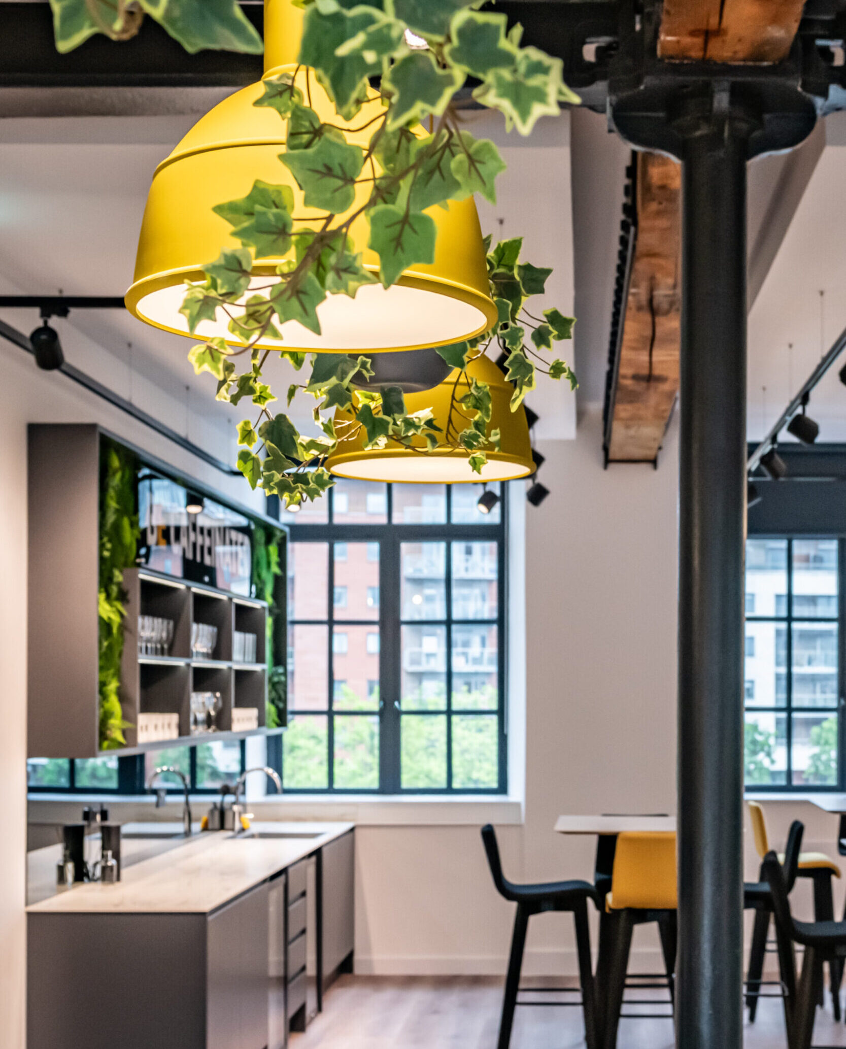 The beyond law group offices with yellow hanging ceiling lights.