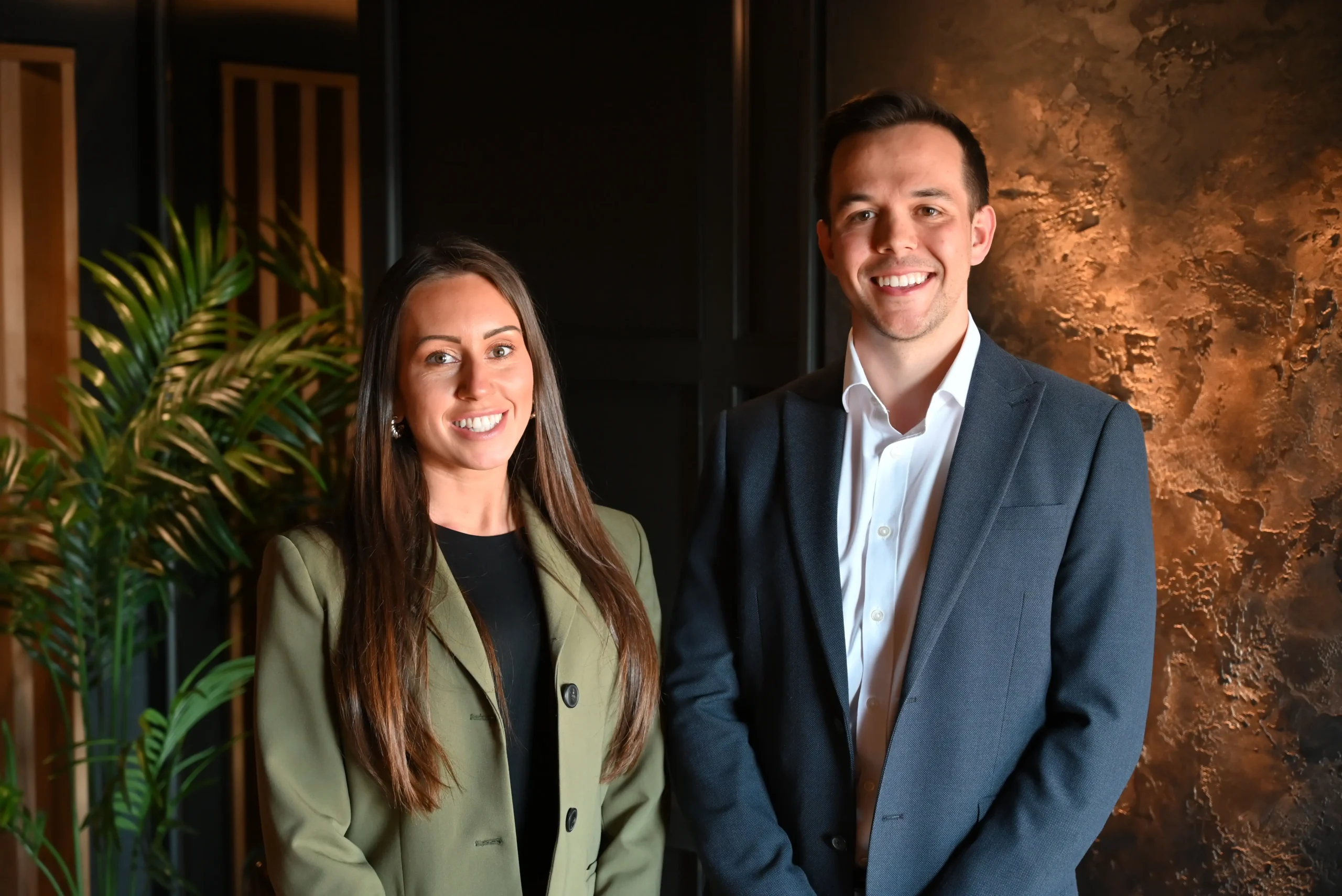 Lucy Cresswell and Russell Kaminski smile for a photo.