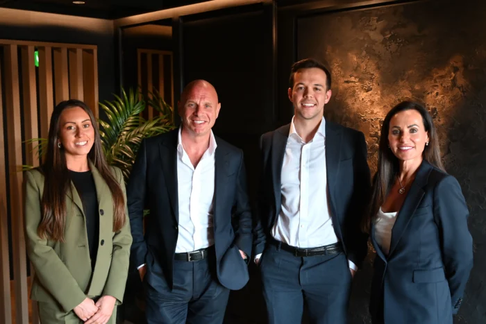 From left to right; Lucy Cresswell, Matt Fleetwood, Russell Kaminski and Amanda McAlister pose for a photography smiling at the camera.
